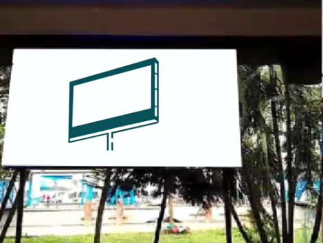 A large, vibrant digital billboard located at the Barishal Launch Terminal, displaying high-resolution ads to travelers and commuters at the terminal's entry gate.